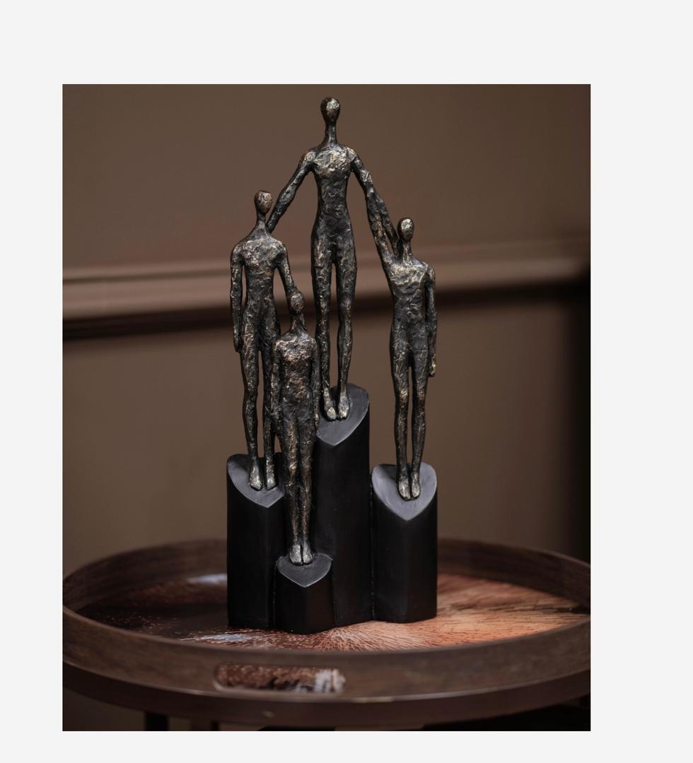 Abstract family sculpture on hearts plinth in bronze finish