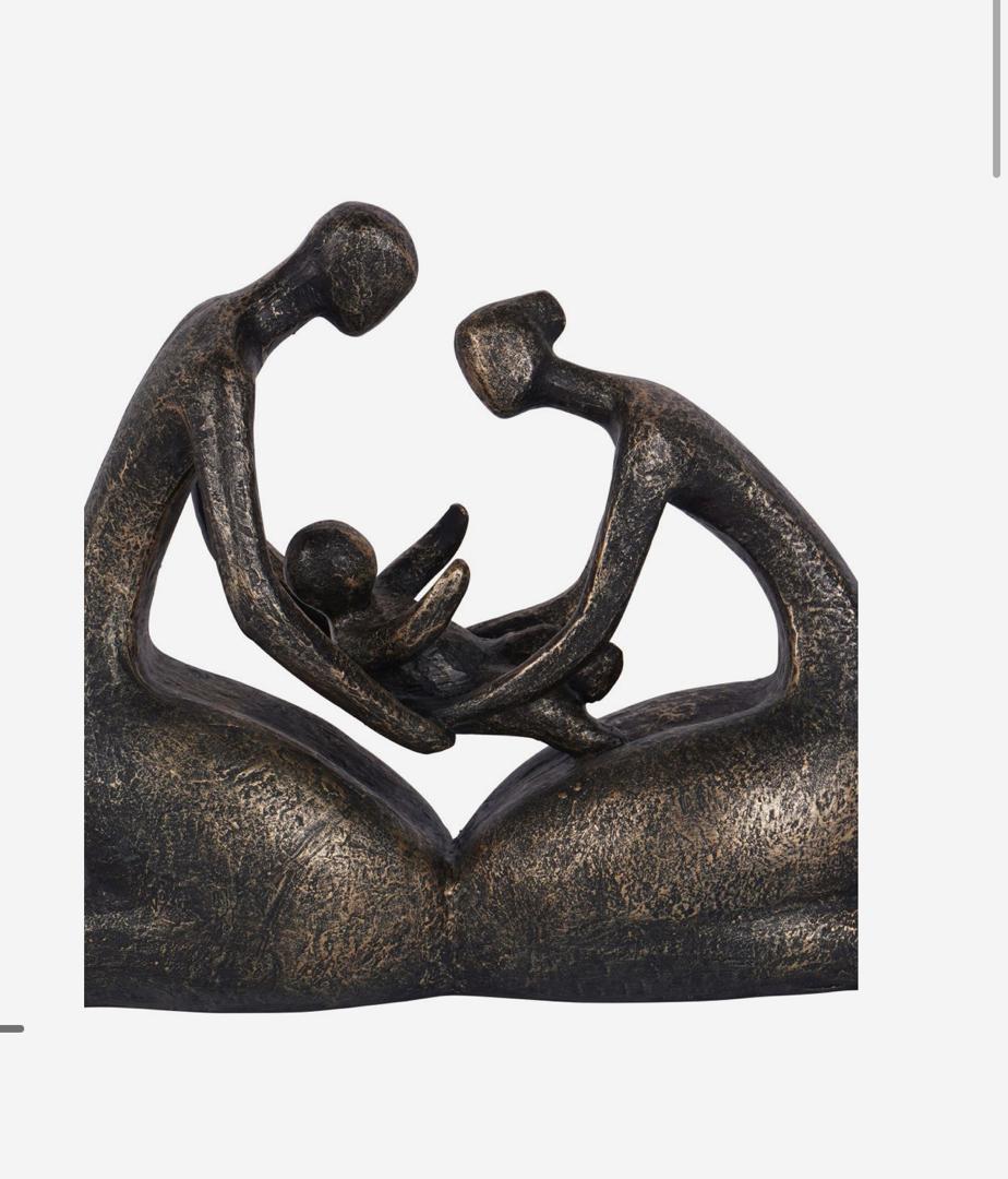 Caring family sculpture with parents and baby in bronze finish