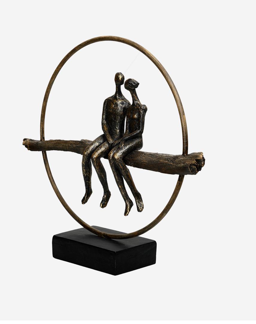 Circle of life couple sculpture with bronze finish and abstract design
