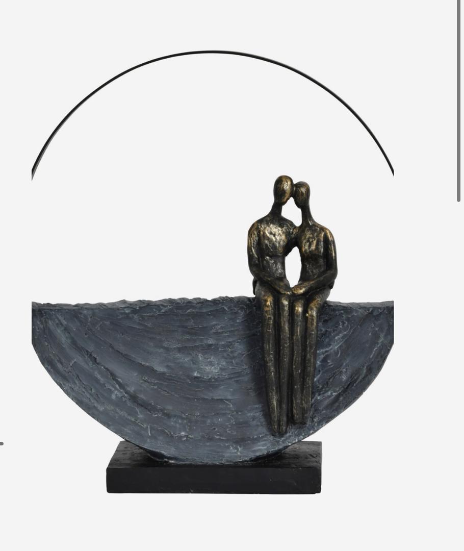 Couple encircled sculpture in bronze with abstract design