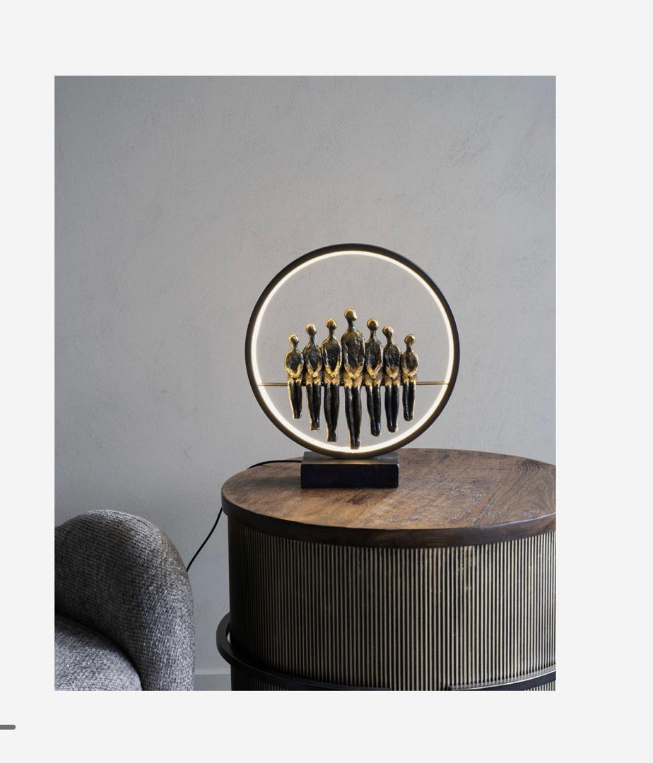 Family LED light sculpture with bronze figures and circular glow