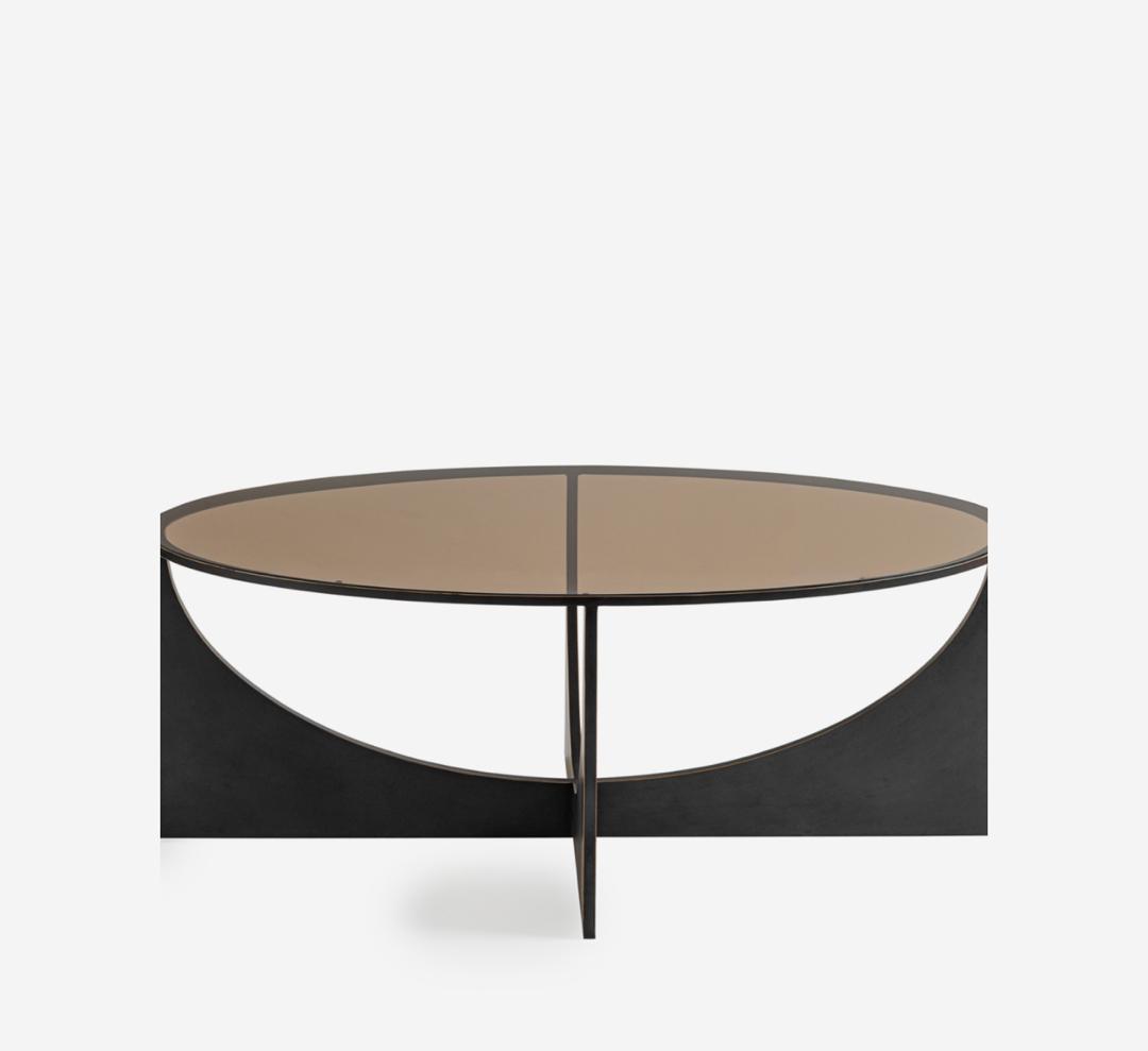 Glenthorpe sculpted coffee table with brown tinted glass top and bronze base