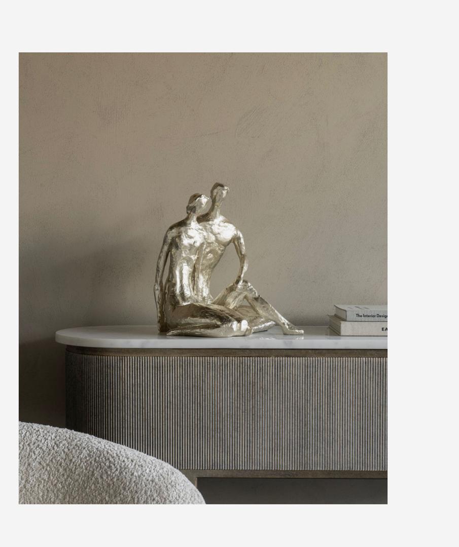 Large loving couple sculpture in champagne gold finish