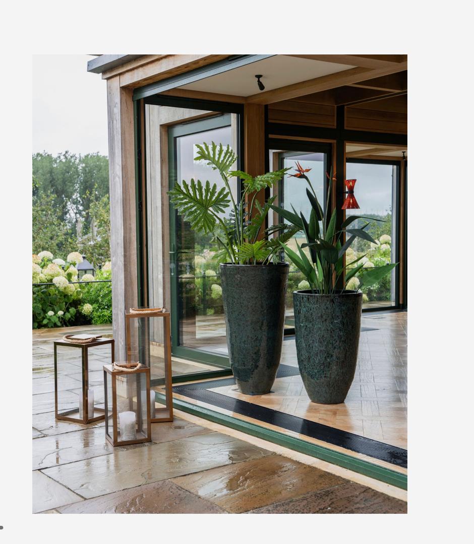 Mederno tall ceramic planter in green with reactive glaze finish