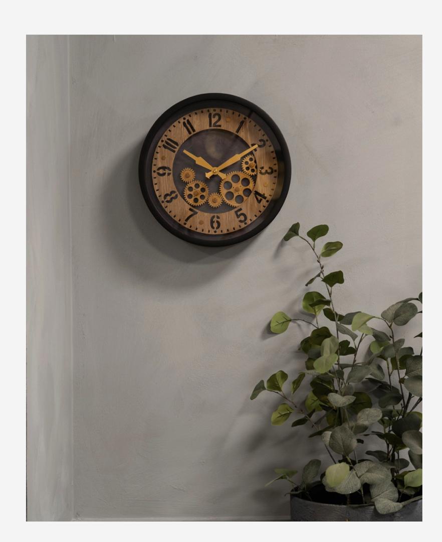 Palladium mini decorative clock in black with moving brass cogs and gold hands