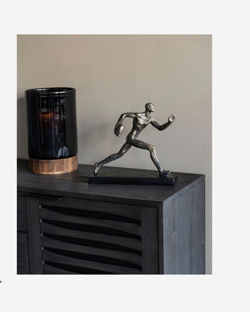 Rugby player sculpture in bronze with triumphant pose