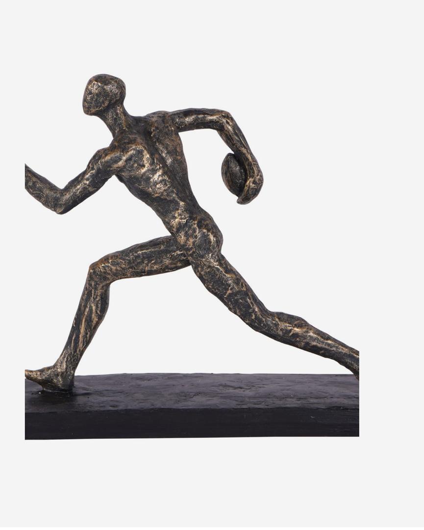 Rugby player sculpture in bronze with triumphant pose