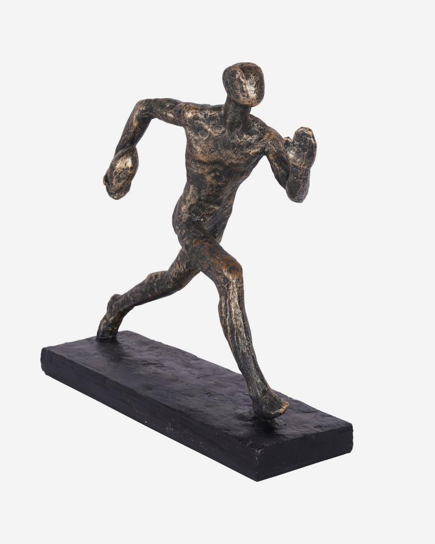 Rugby player sculpture in bronze with triumphant pose