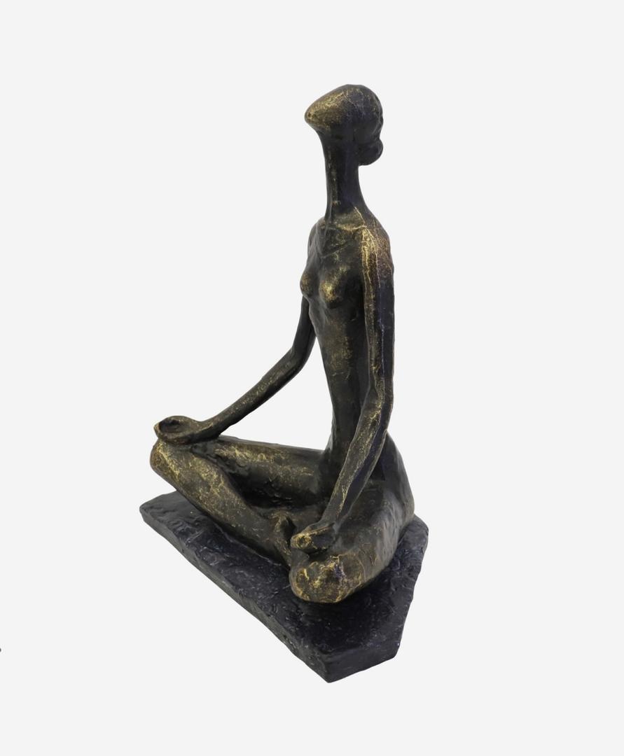 Yoga pose sculpture in bronze finish with serene female figure